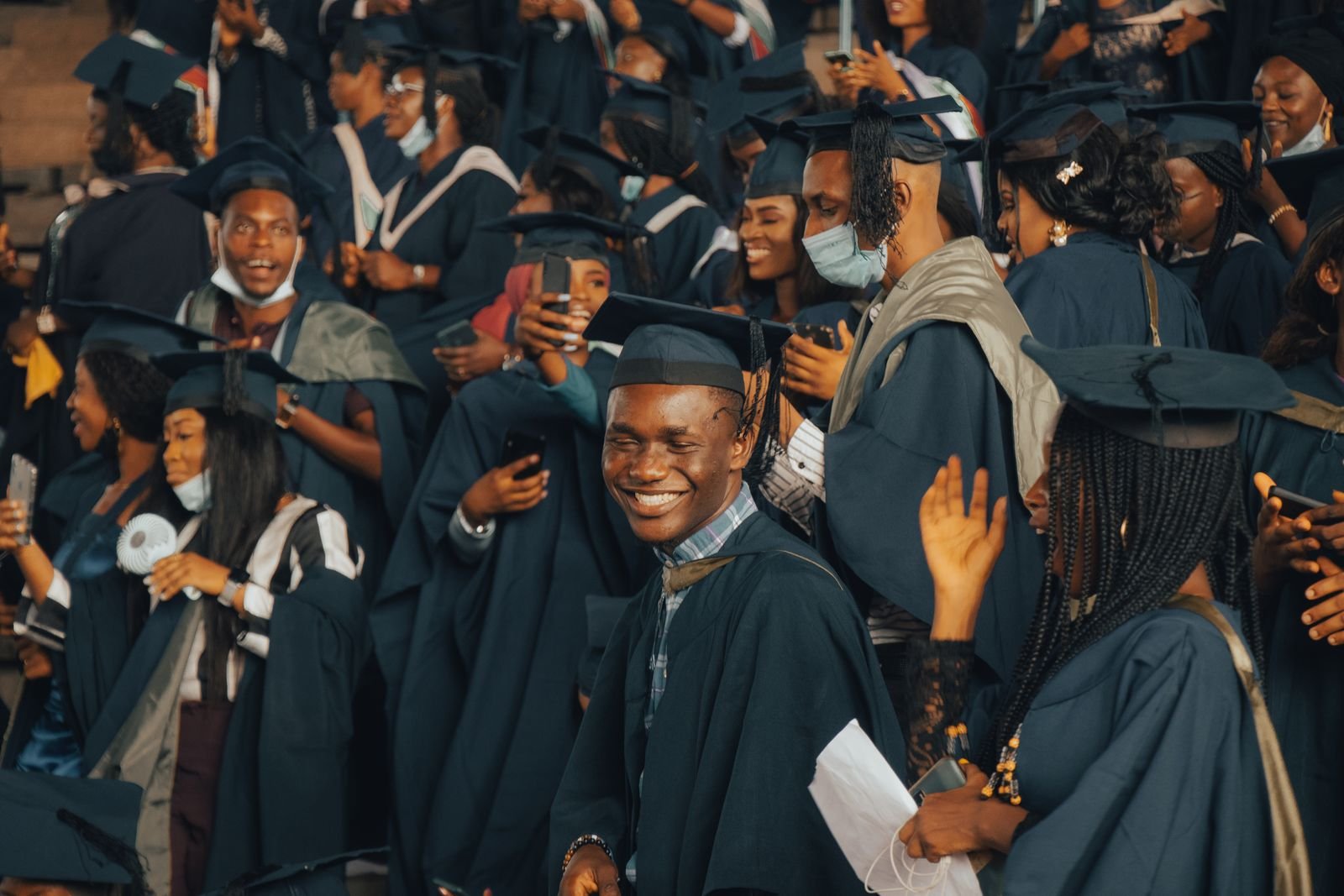 South African graduates celebrating in caps and gowns