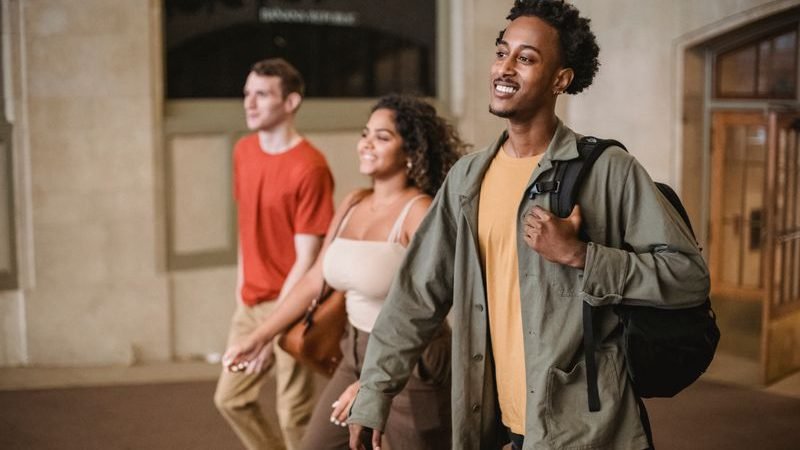 Students walking through a university campus between lectures